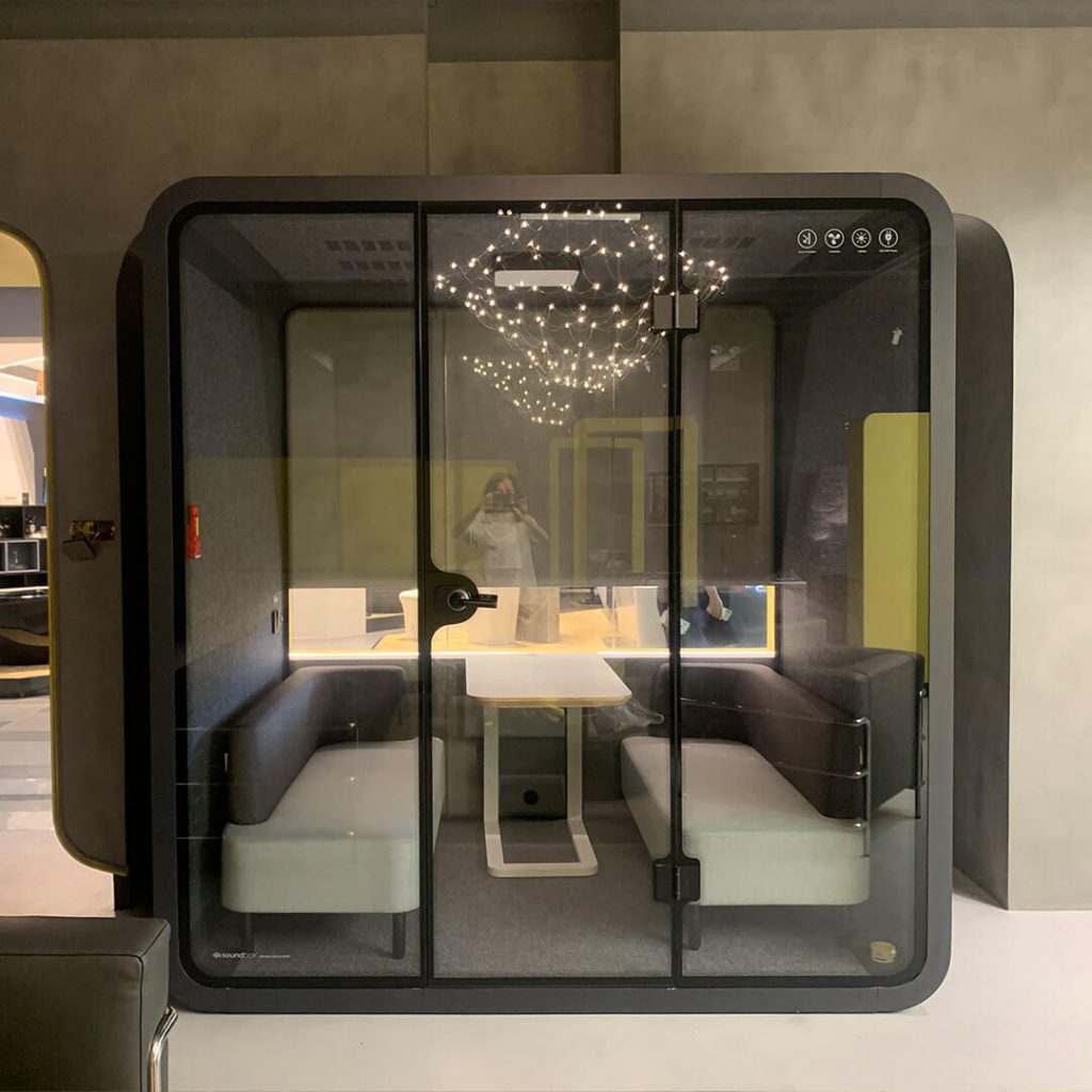 Soundbox's x-large black office privacy pods placed in open office